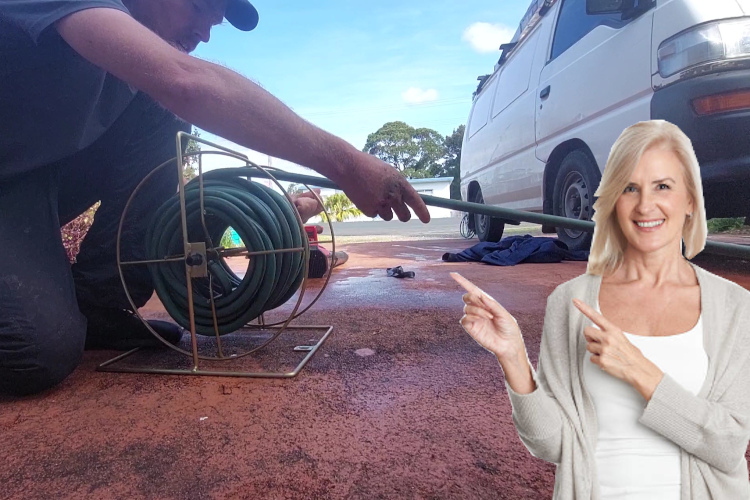 
After a day of gutter rinsing, a batemansbay professional neatly packs away the hose.